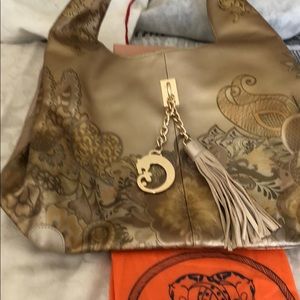 Beautiful gold Sharif handbag, unique hardware.